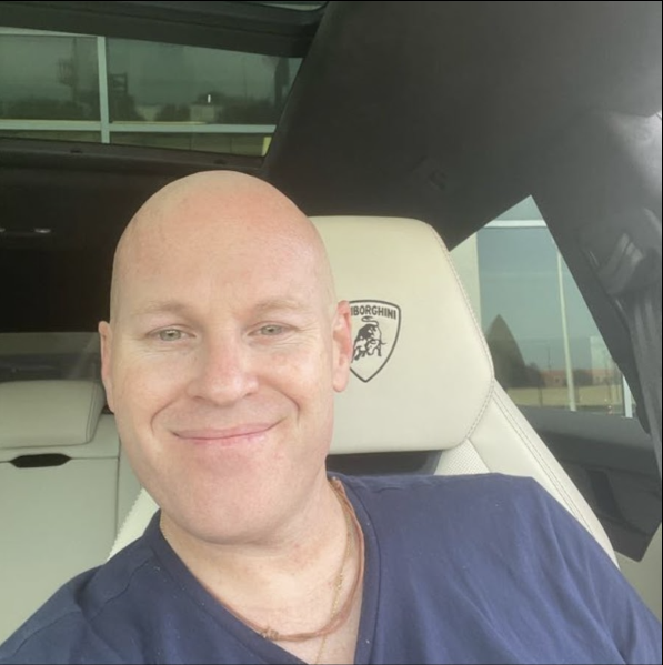 Green double couch with wooden legs